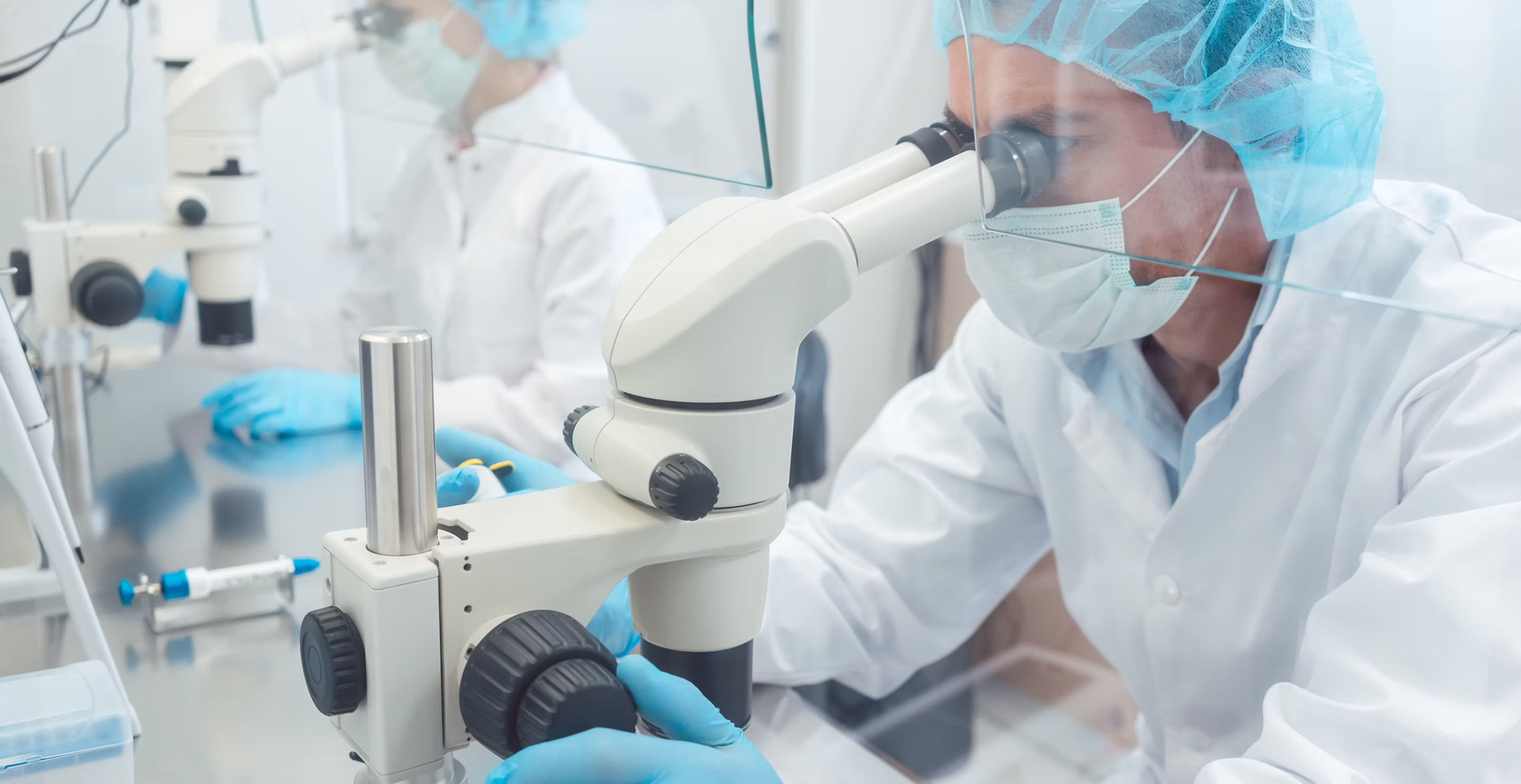 Medical Researcher at Microscope
